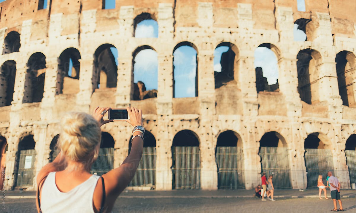 Tourist Takes a Photo of the Colosseum