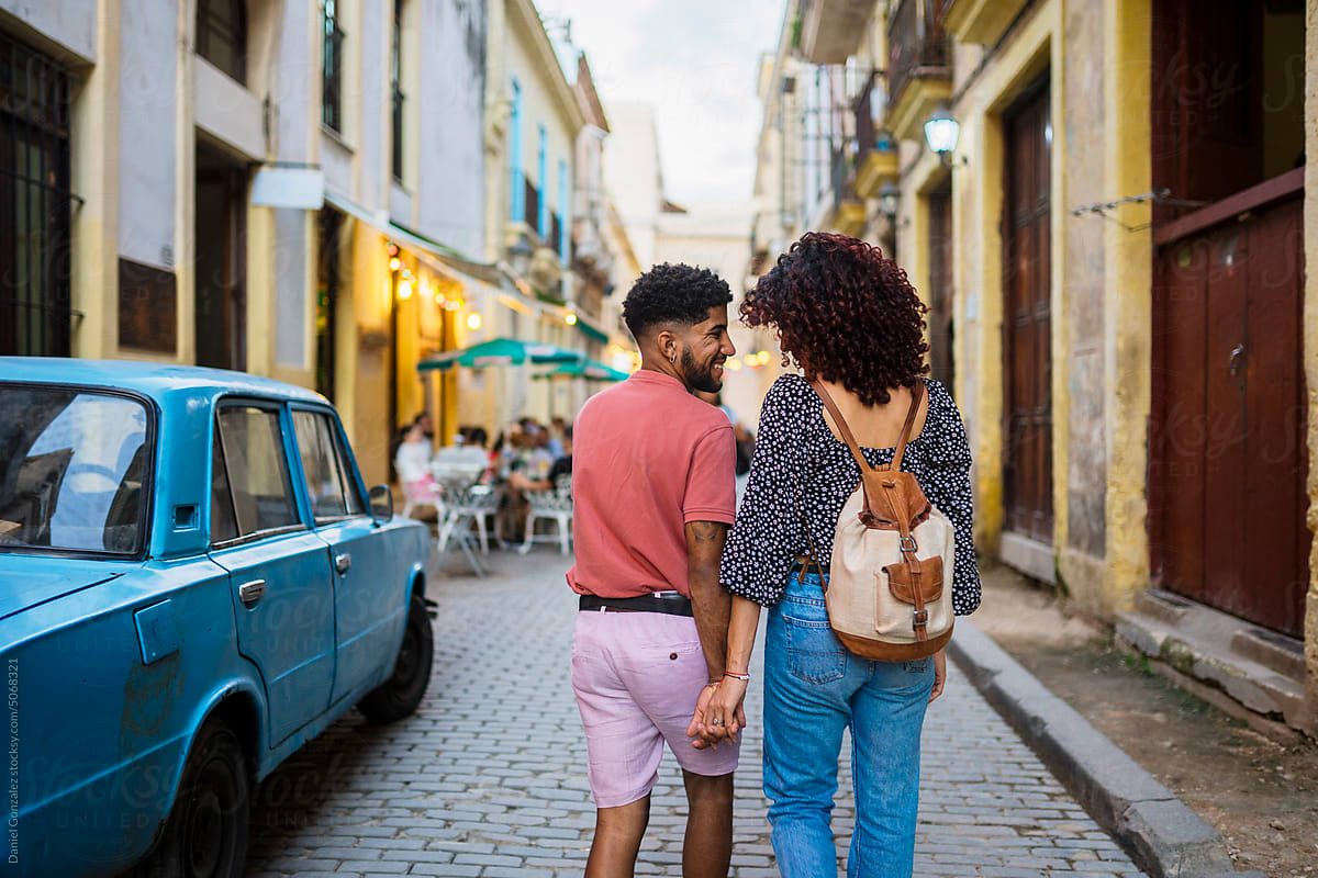 Cuban man and woman during date on street
