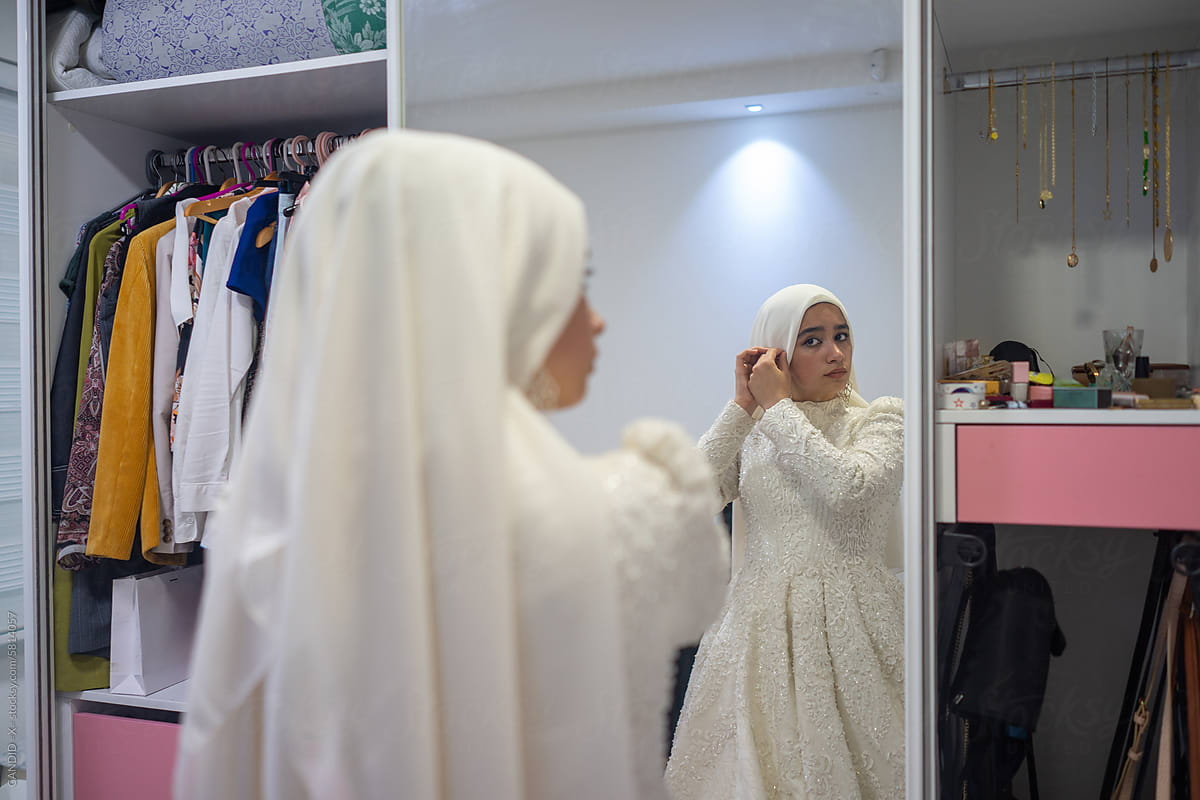 Muslim Bride Fixing her Hijab