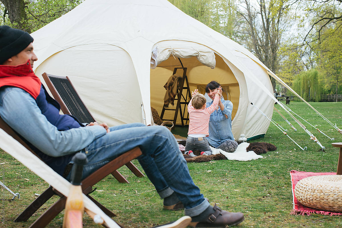 Glamping - Caucasian Family of Three Outside Large Circular Tent