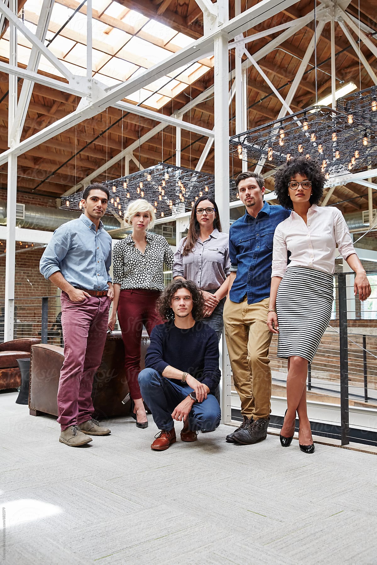Group portrait of millennials in high tech office