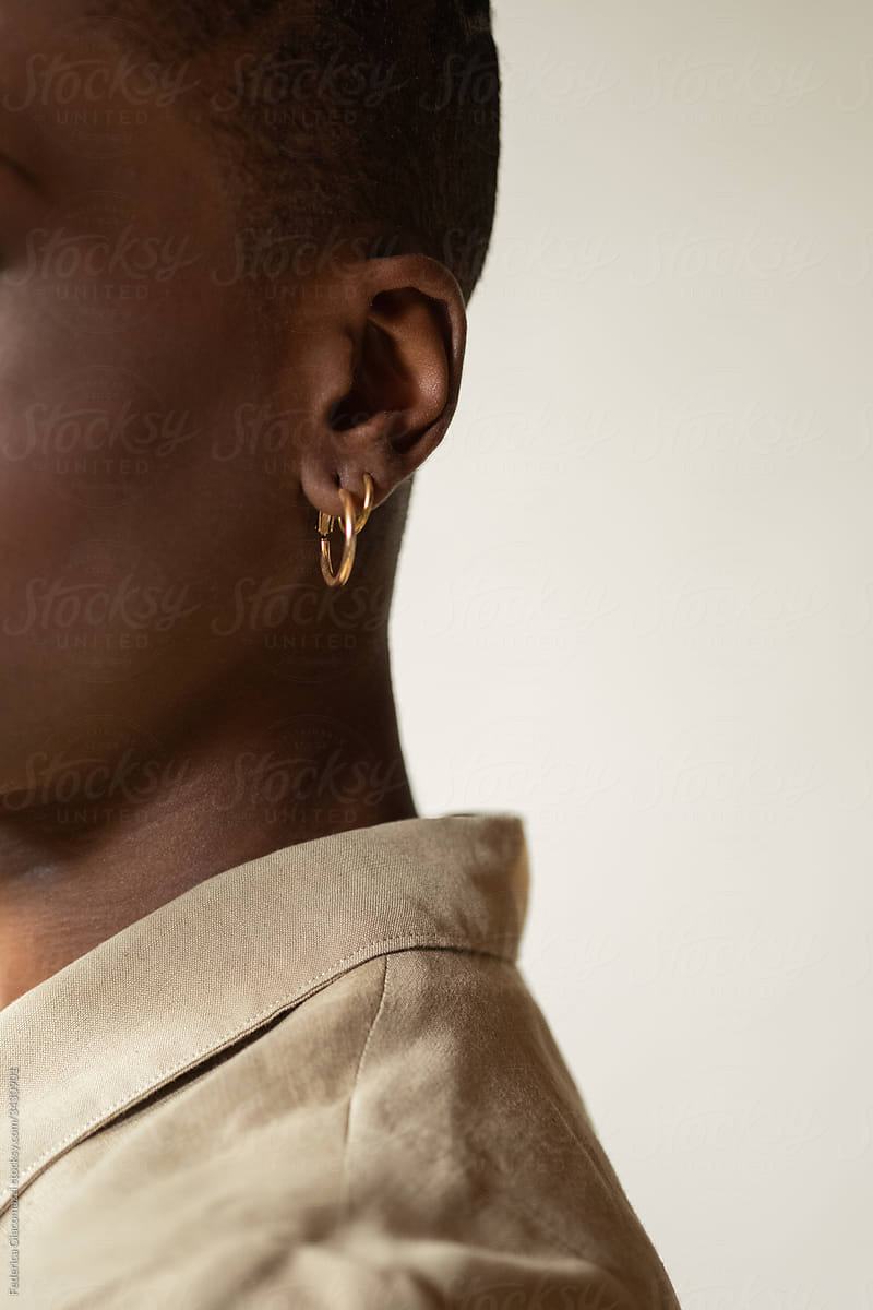 Black Woman Ear and Earrings Detail