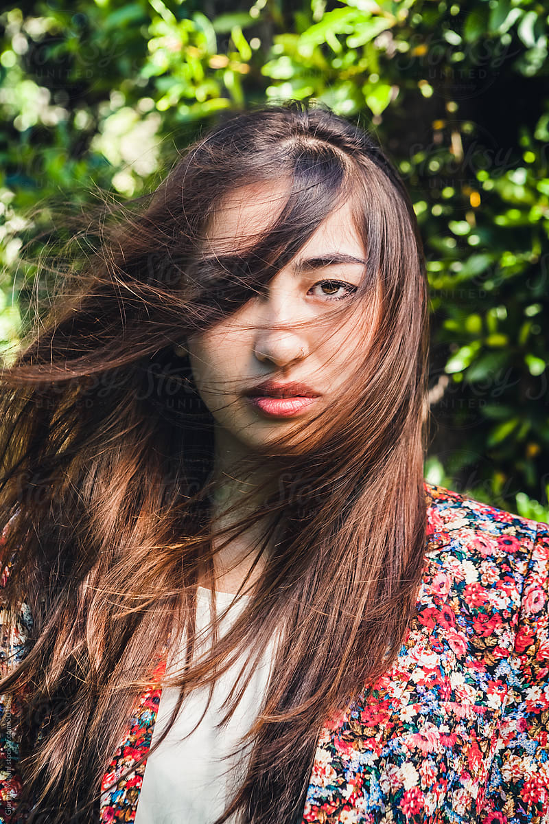 Windy Portrait of an Asian Girl with Long Hair