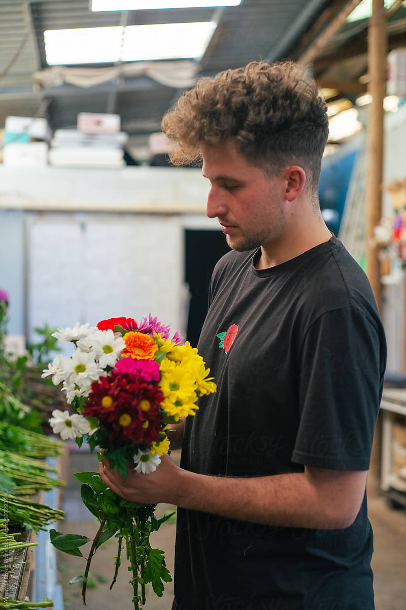 Man holding a flower bouquet
