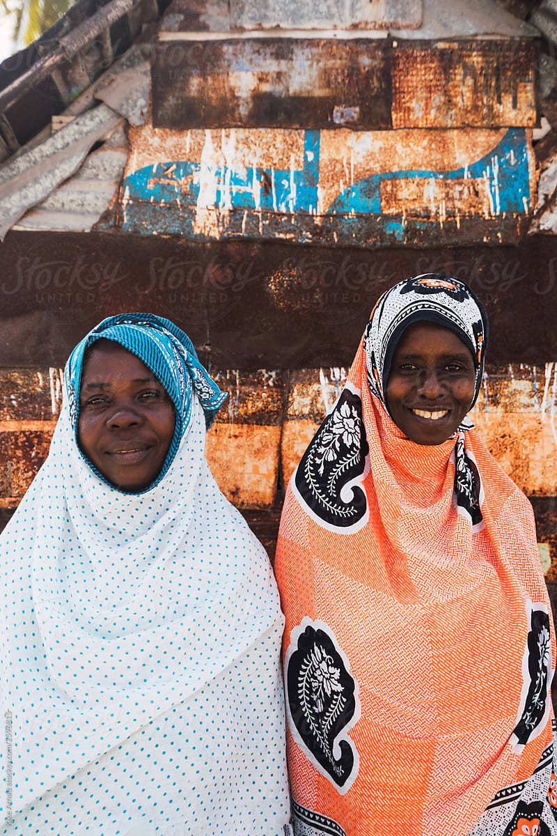 Portrait of two women together, dressed in a hijab with African
