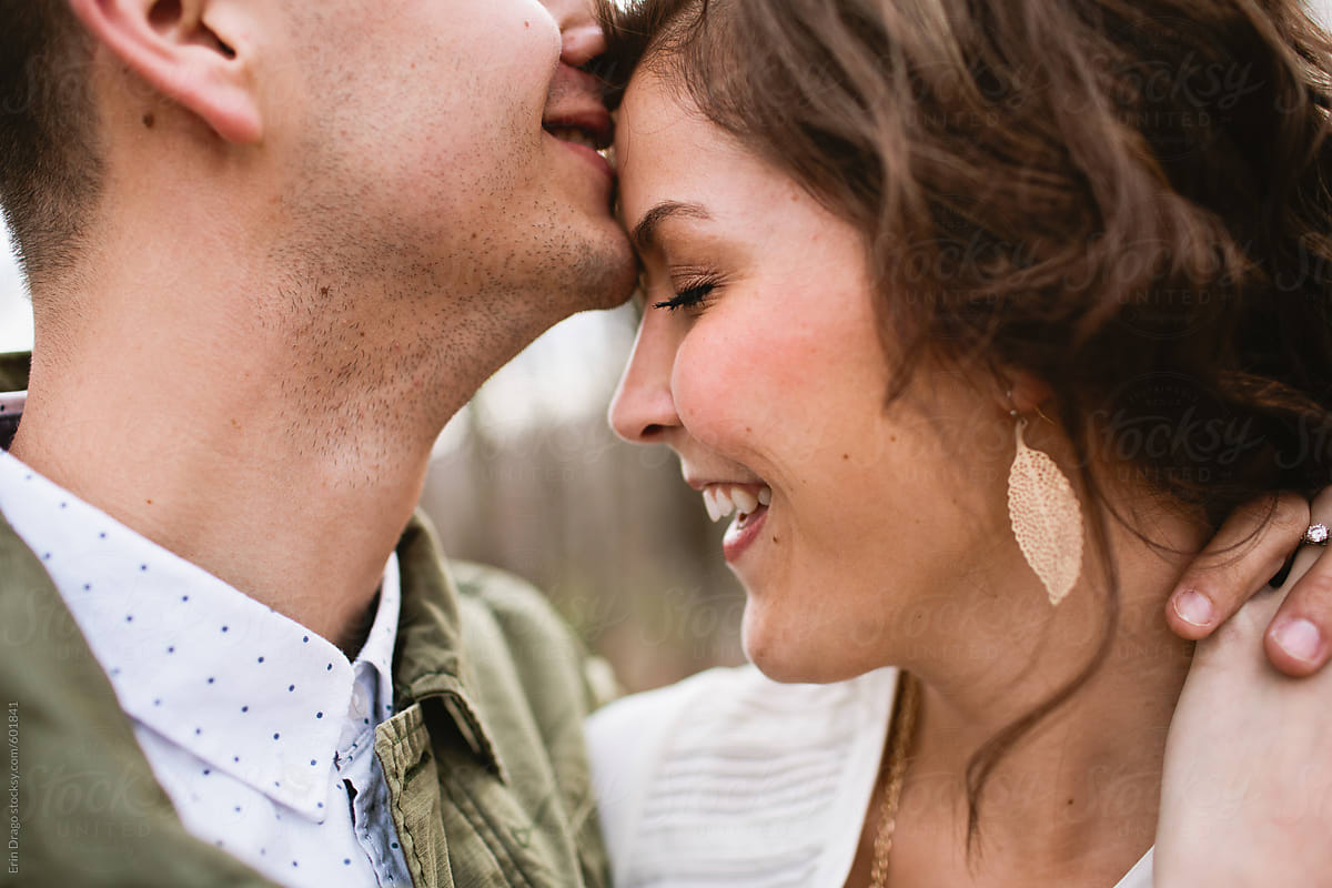 Man Kissing Woman On Forehead By Stocksy Contributor Erin Drago Stocksy