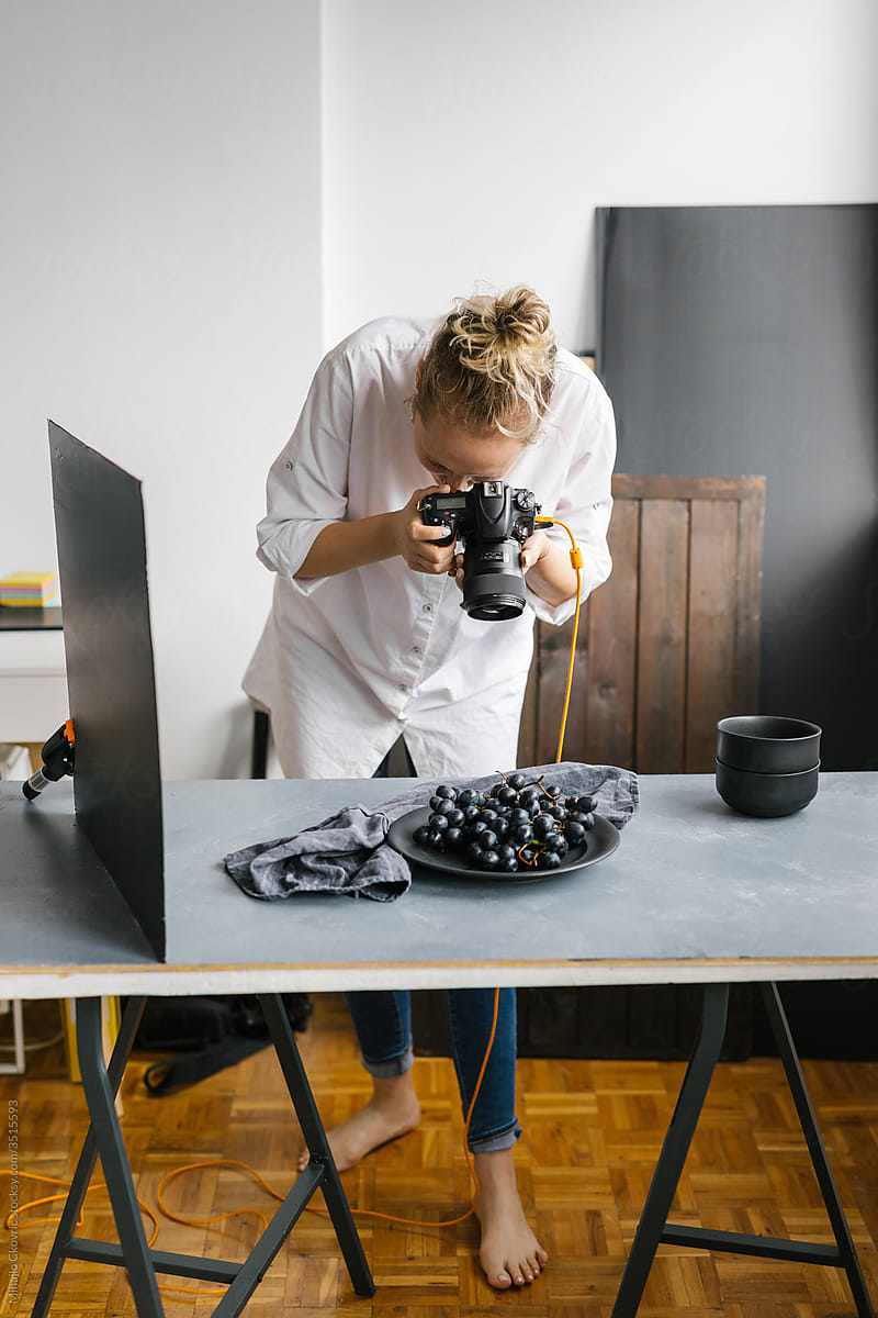 Female photographer working in a studio
