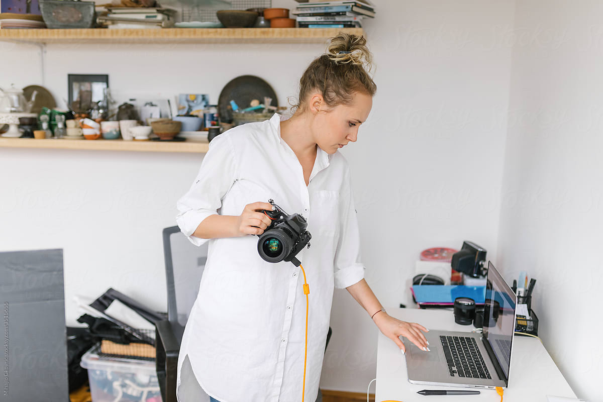 Female photographer working in a studio