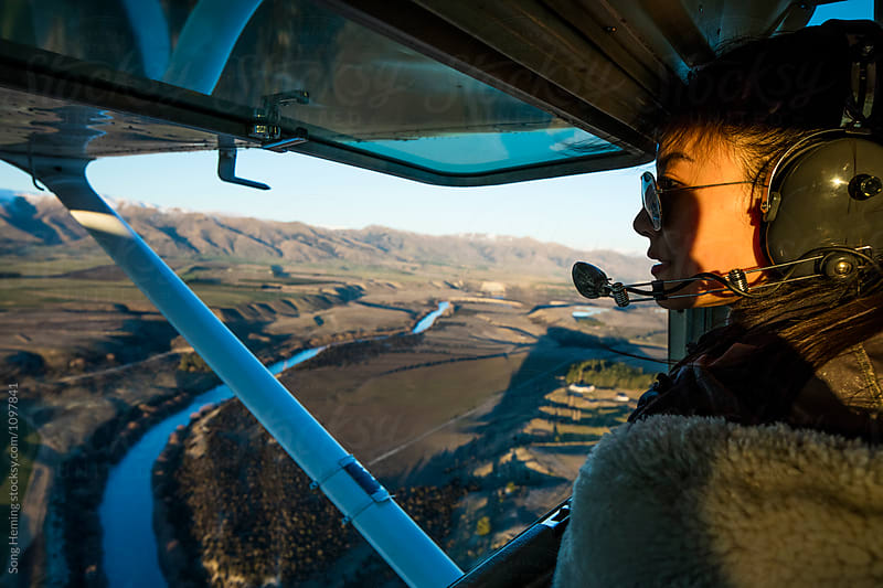 A pilot looking out an aircraft window