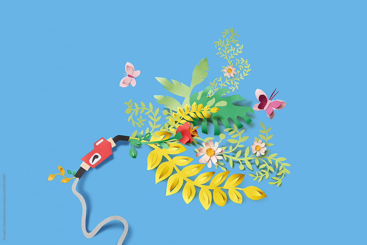 Papercraft gasoline pistol pump with blooming plants and butterflies