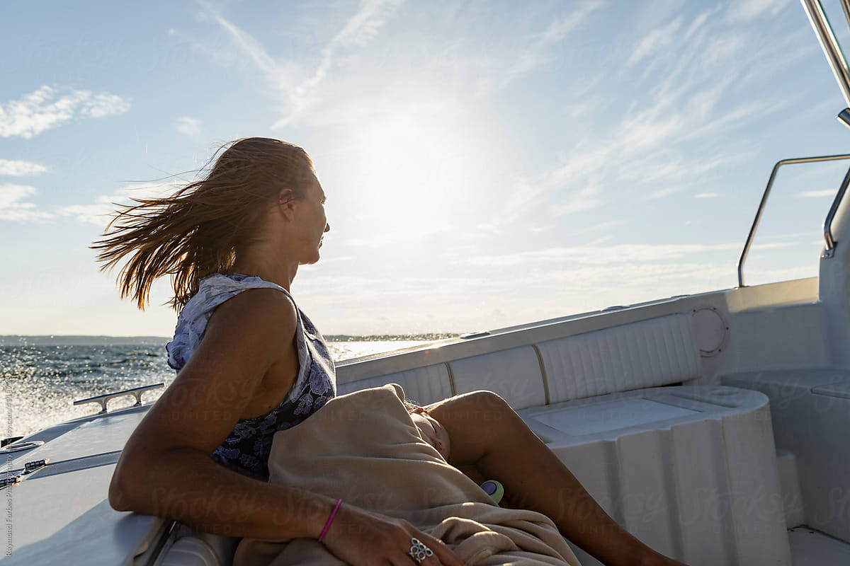 Woman Riding in Boat on ocean
