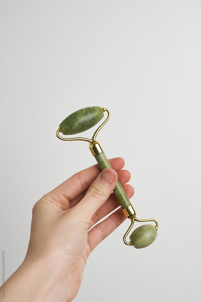 Skincare Jade Roller Held Up By Hand