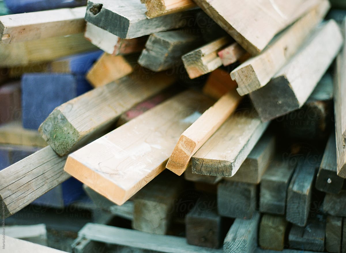 Close up of a pile of scrap colored wood and lumber