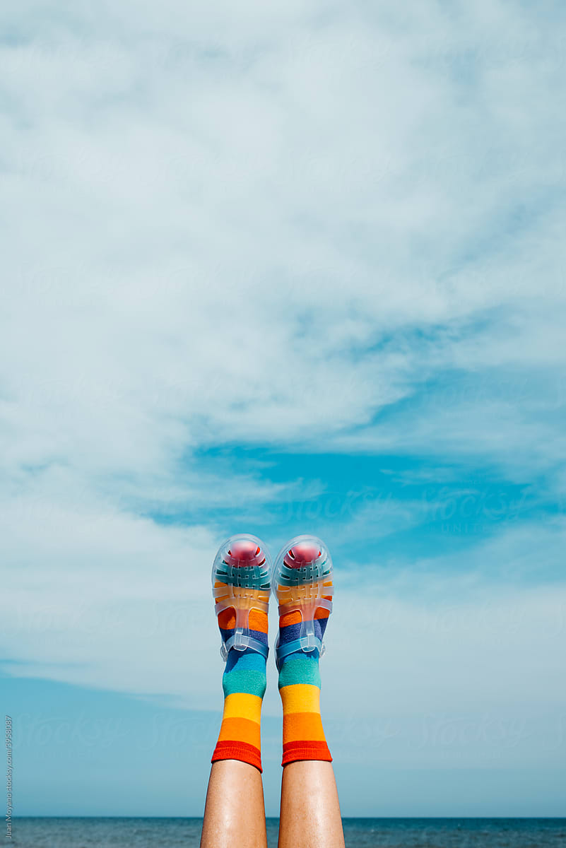 rainbow patterned socks and sandals upside-down