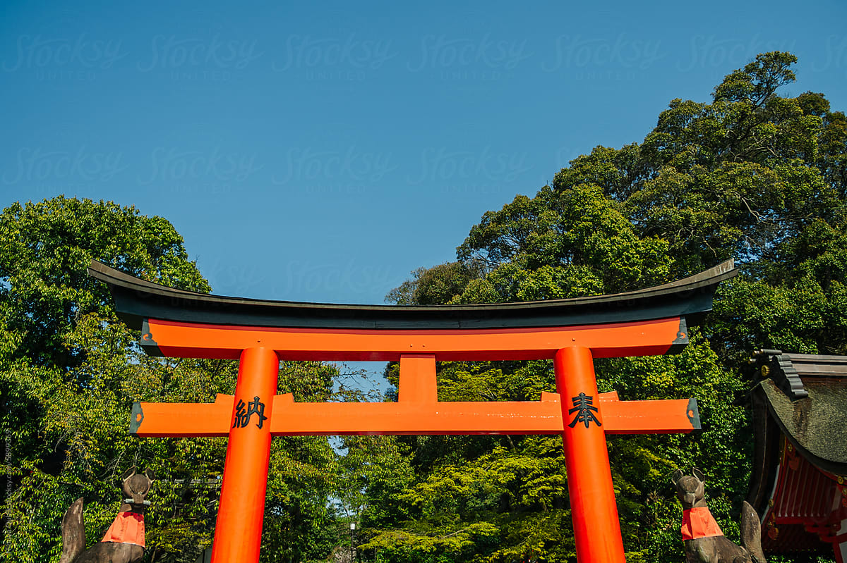Detail of large vibrant orange torii gate
