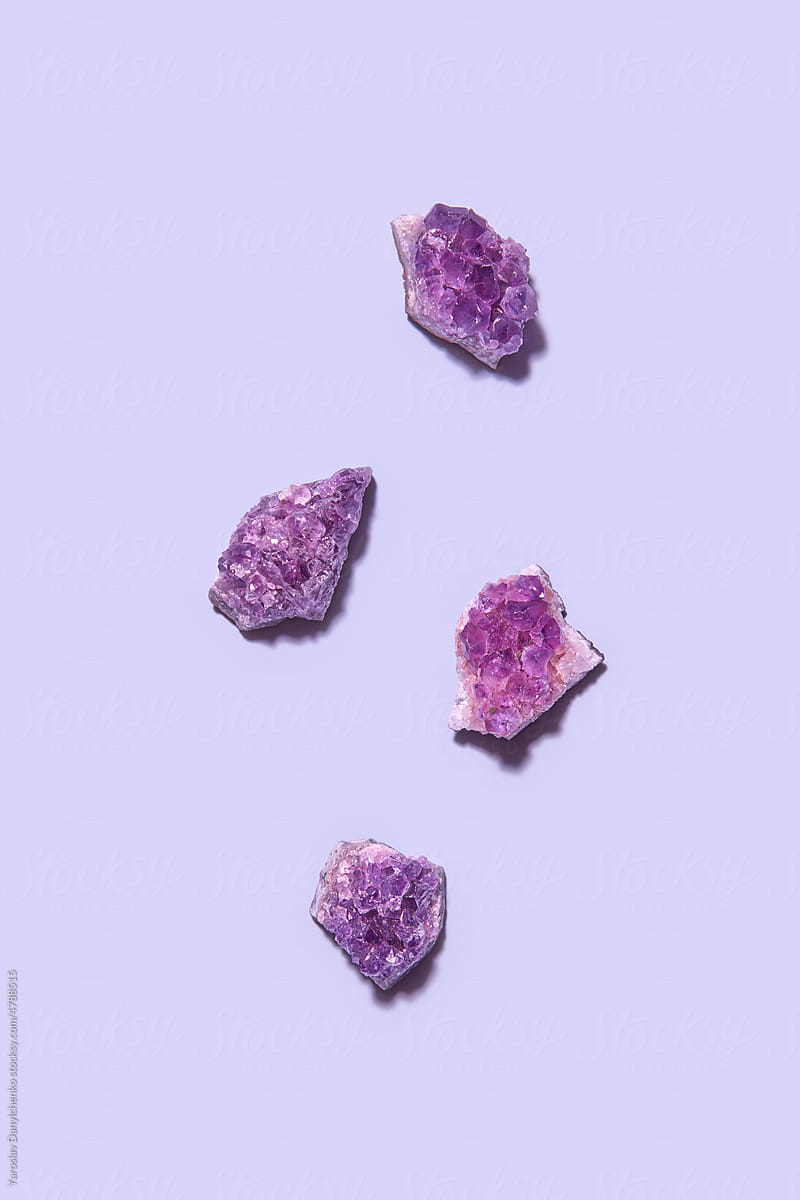 Purple amethyst gems on same colored background