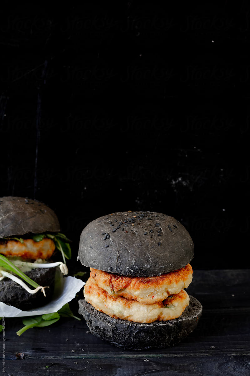 Double fish burger in black bun