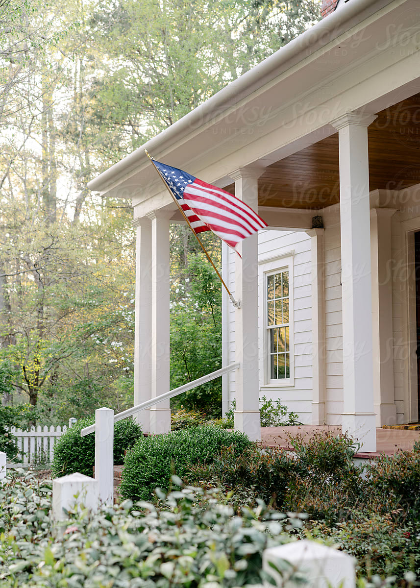Southern front porch with American flag