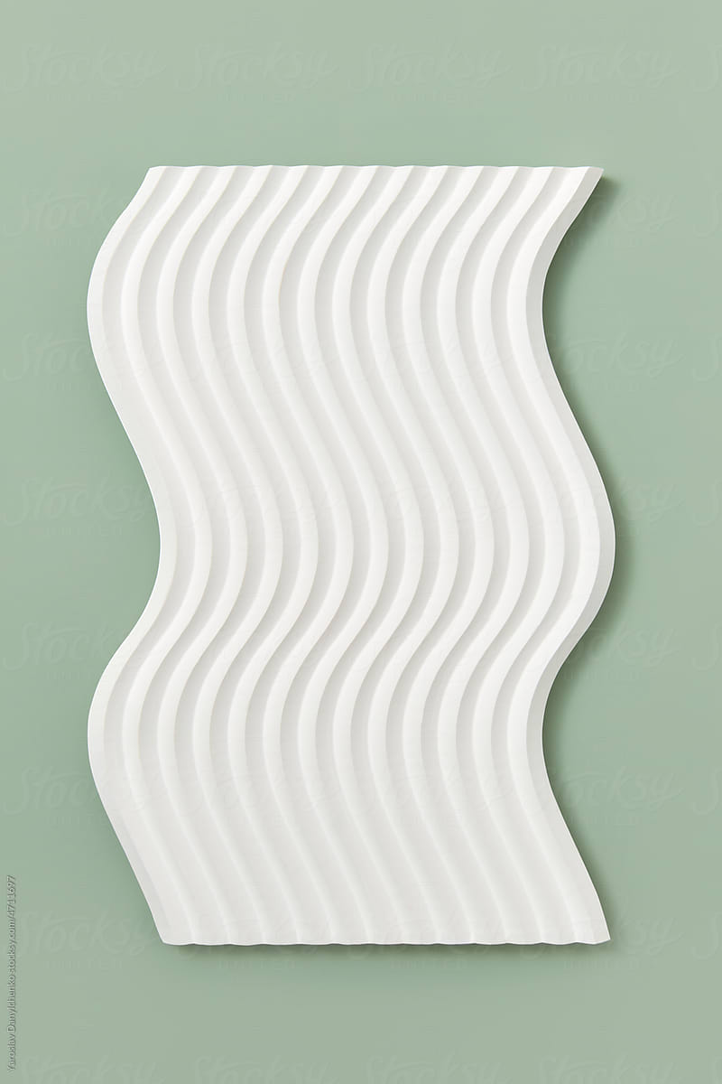 White panel with wavy pattern on green.