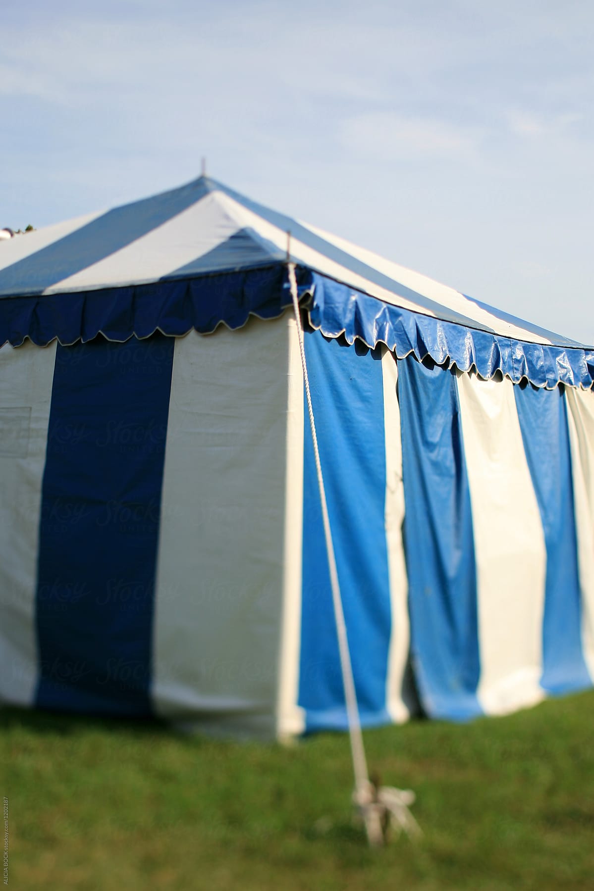 A Blue And White Striped Circus Tent