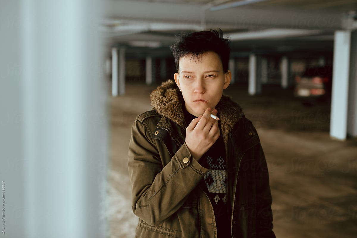 Real lesbian girl smoking on the parking area