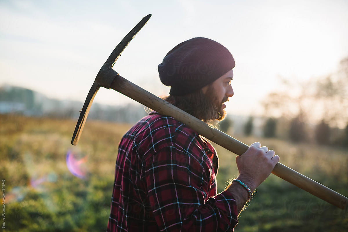 Young Lumberjack Walking With Pickaxe On The Shoulder By Simone Wave Lumberjack Working Stocksy United