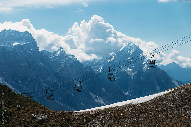 Ski lift infront of mountains