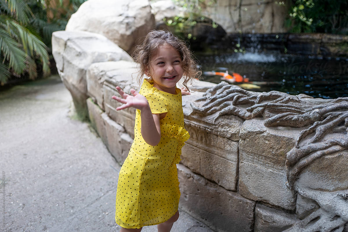ugc image of girl waving and smiling at the zoo