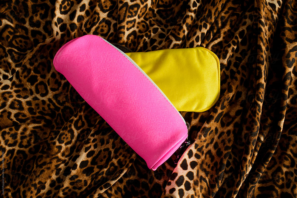 yellow cloth menstrual pad in a pink storage bag