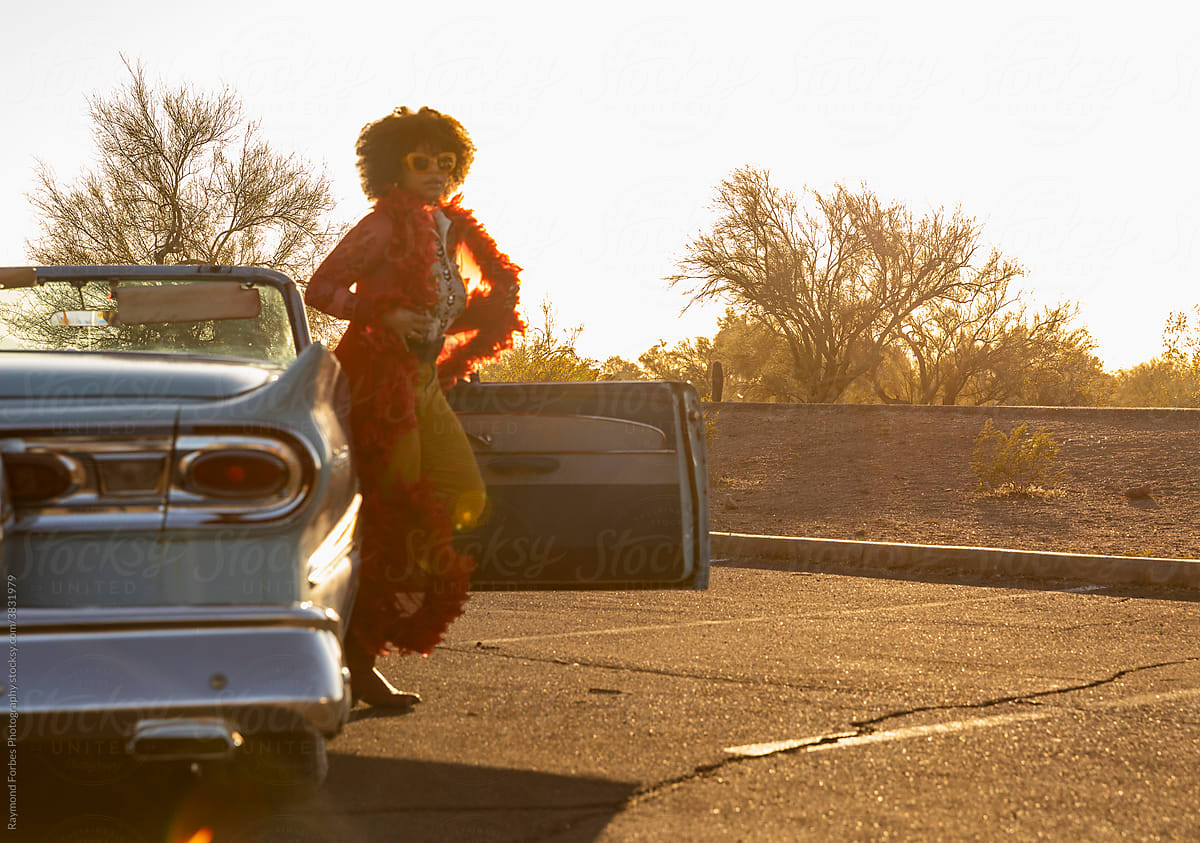 Woman Get out of car on Fashion Shoot with Vintage Automobile