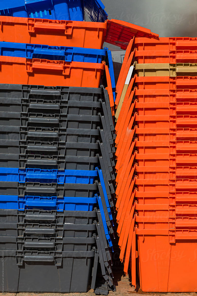 Orange and blue plastic boxes stacked
