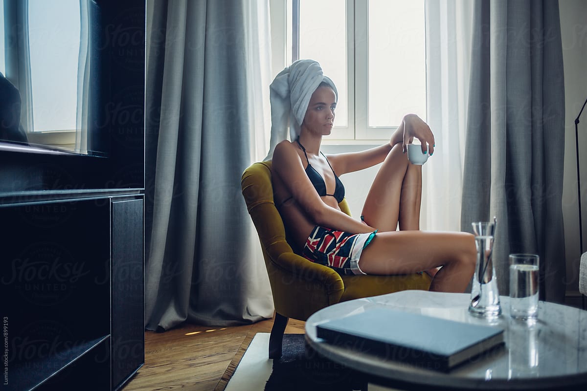 Man Sitting In Hotel Room In His Underwear by Stocksy Contributor