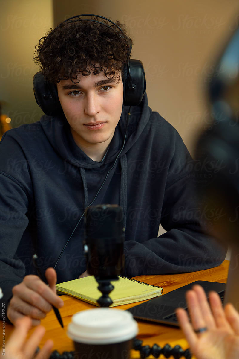 Teen blogger listening to podcast guest