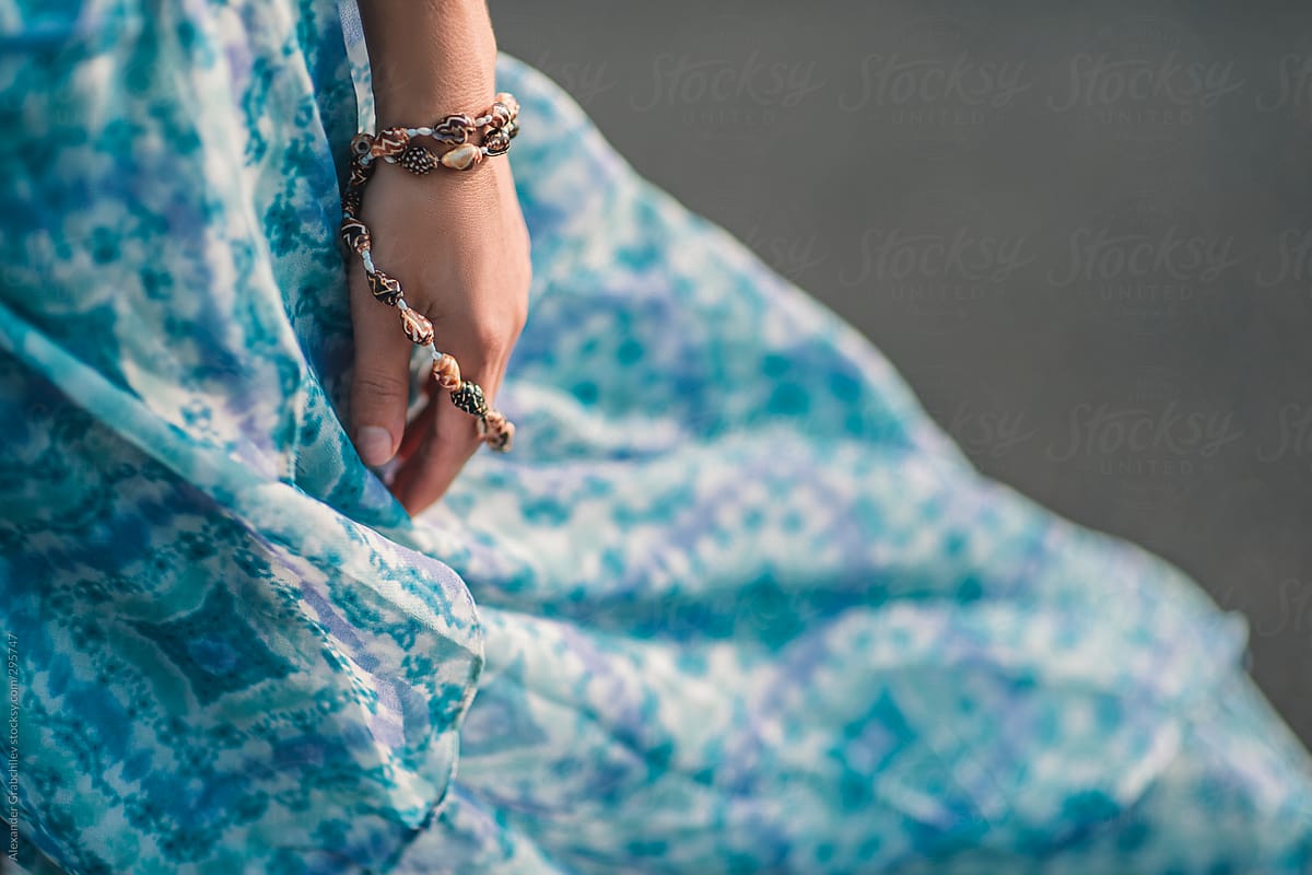 Woman's hand with seashell bracelet