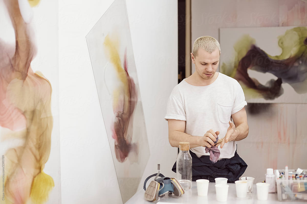 Man working in art studio creating painting
