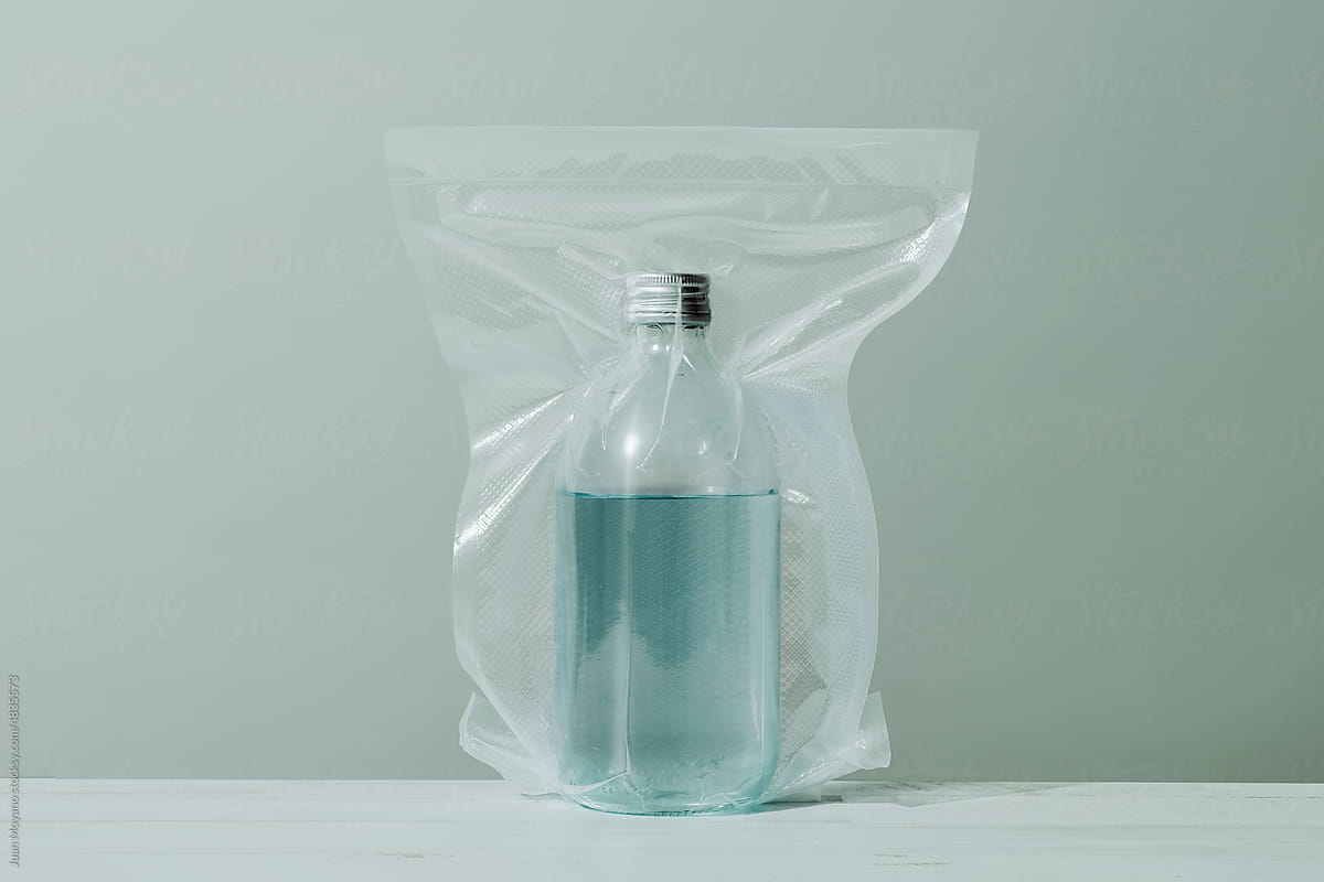 vacuum packed glass bottle with water