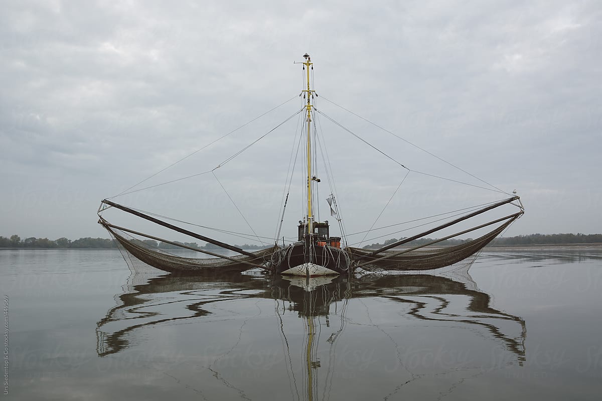 Old Wooden Fishing Boat With Two Extension Arms With Trawling Nets