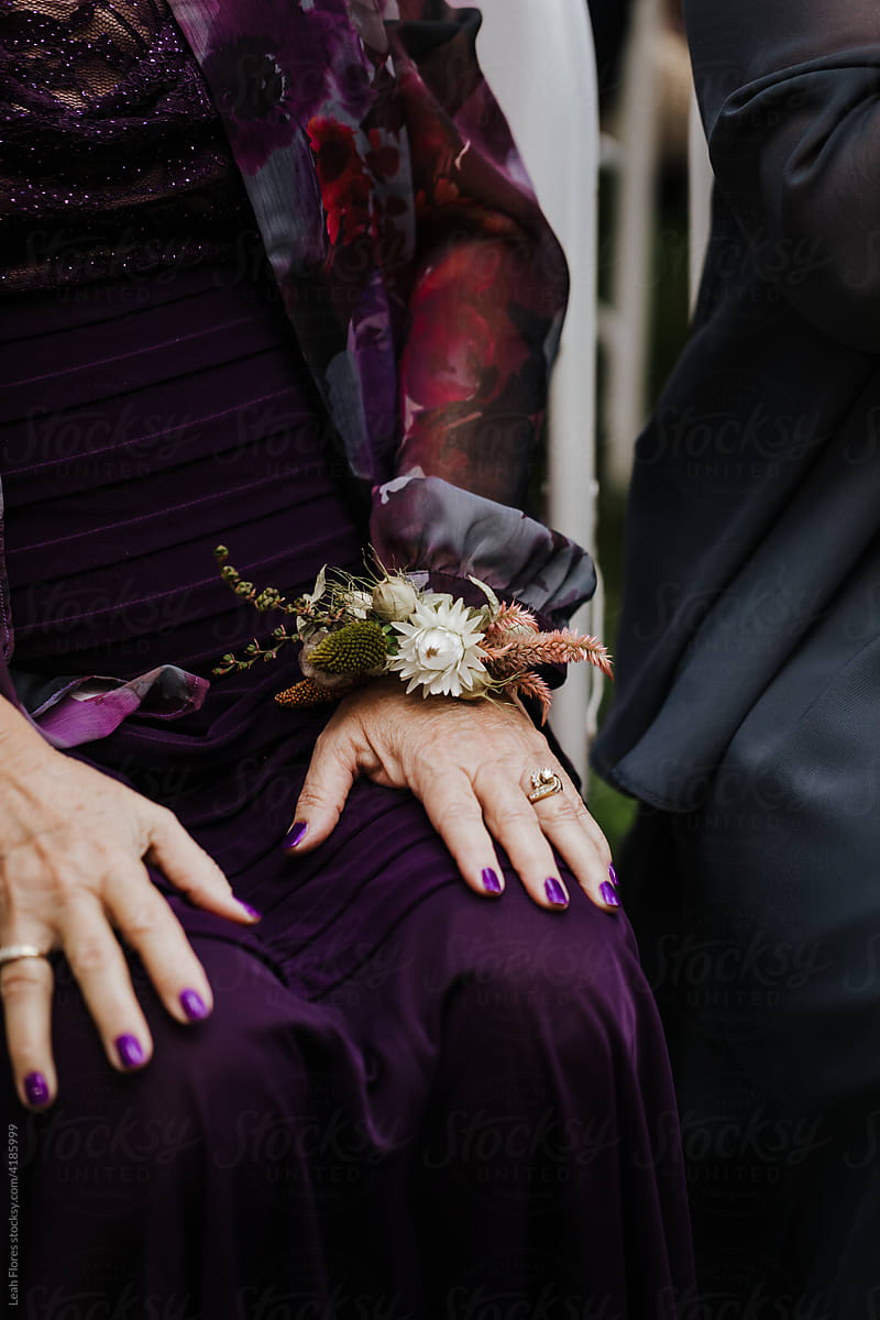 Closeup of Grandmother\'s Hand at Corsage at Wedding