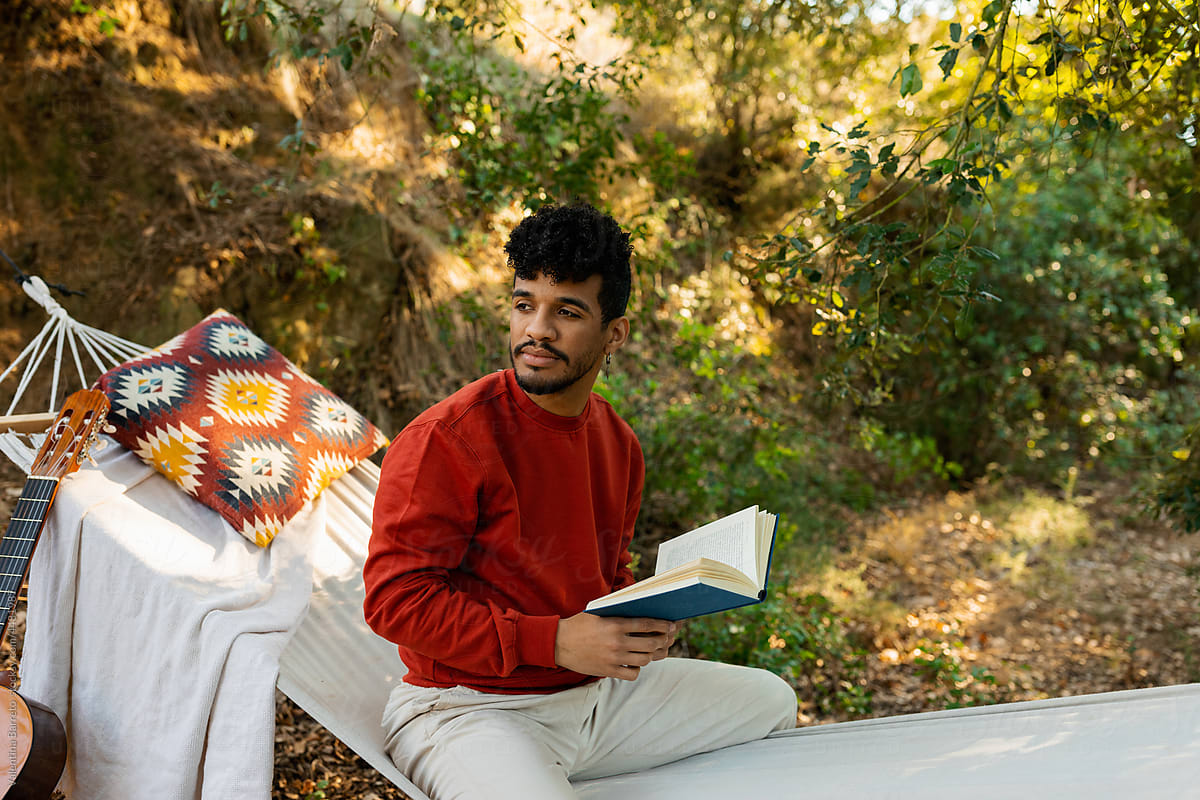 young man reading outdoor