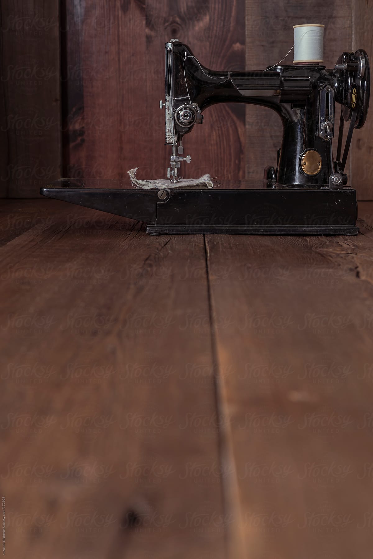 Antique 1950\'s Sewing Machine against Wood Background