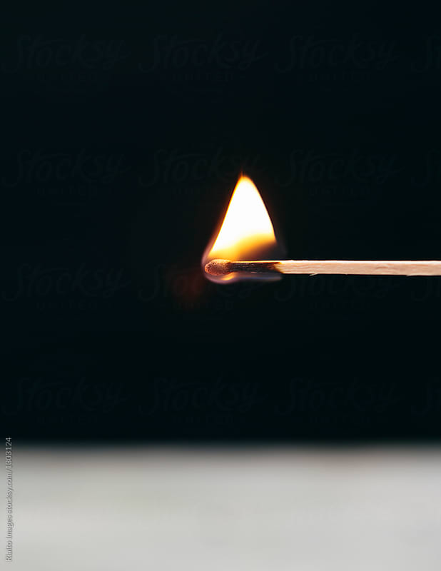 Close up lit match and flame