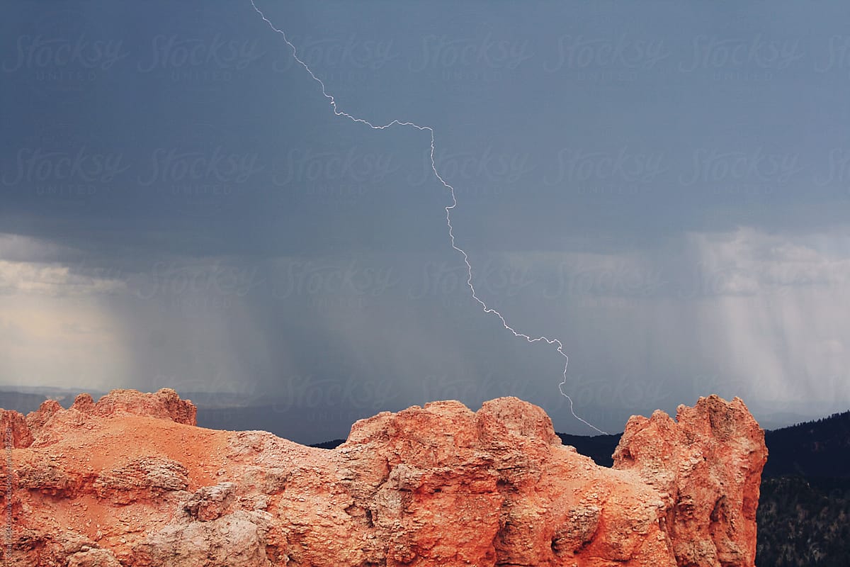 A thunderstorm with lighting as the backdrop to Natural Bridge, Bryce Canyon National Park.