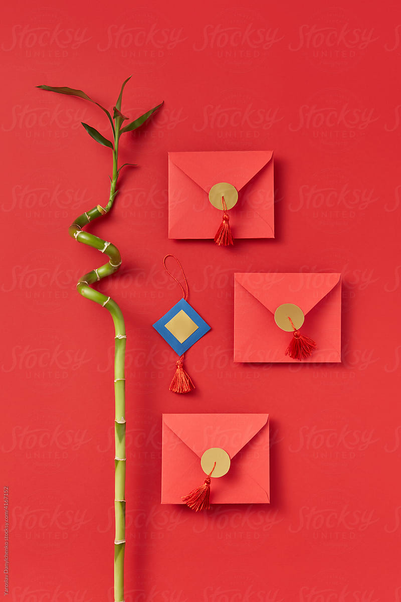 Red envelopes and bamboo twig