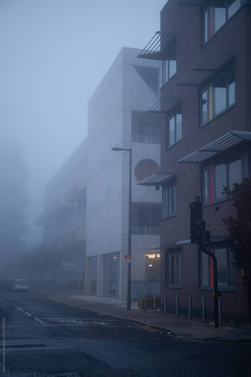 Buildings on a foggy street in East London