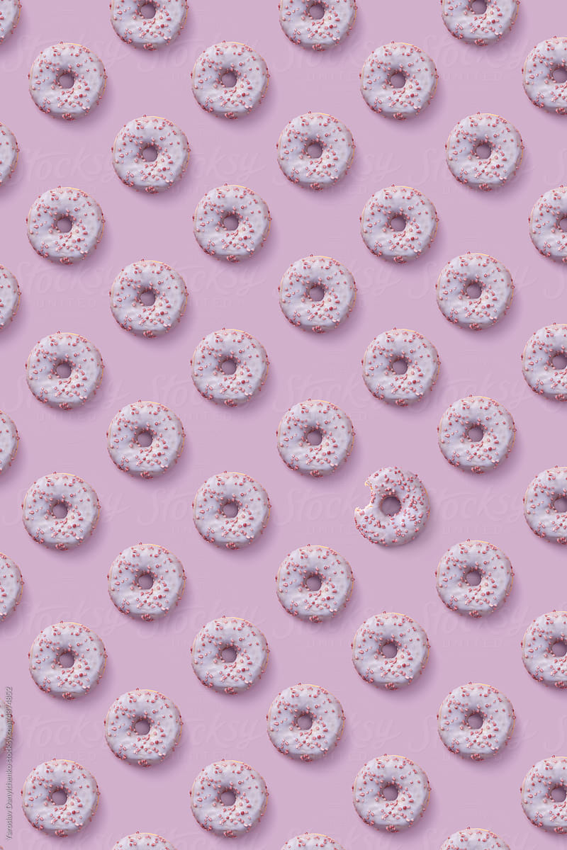 Pattern of glazed donuts with sprinkles