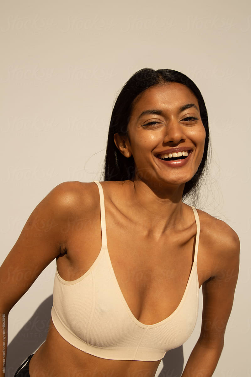 Natural skin woman smiling and wearing white bra