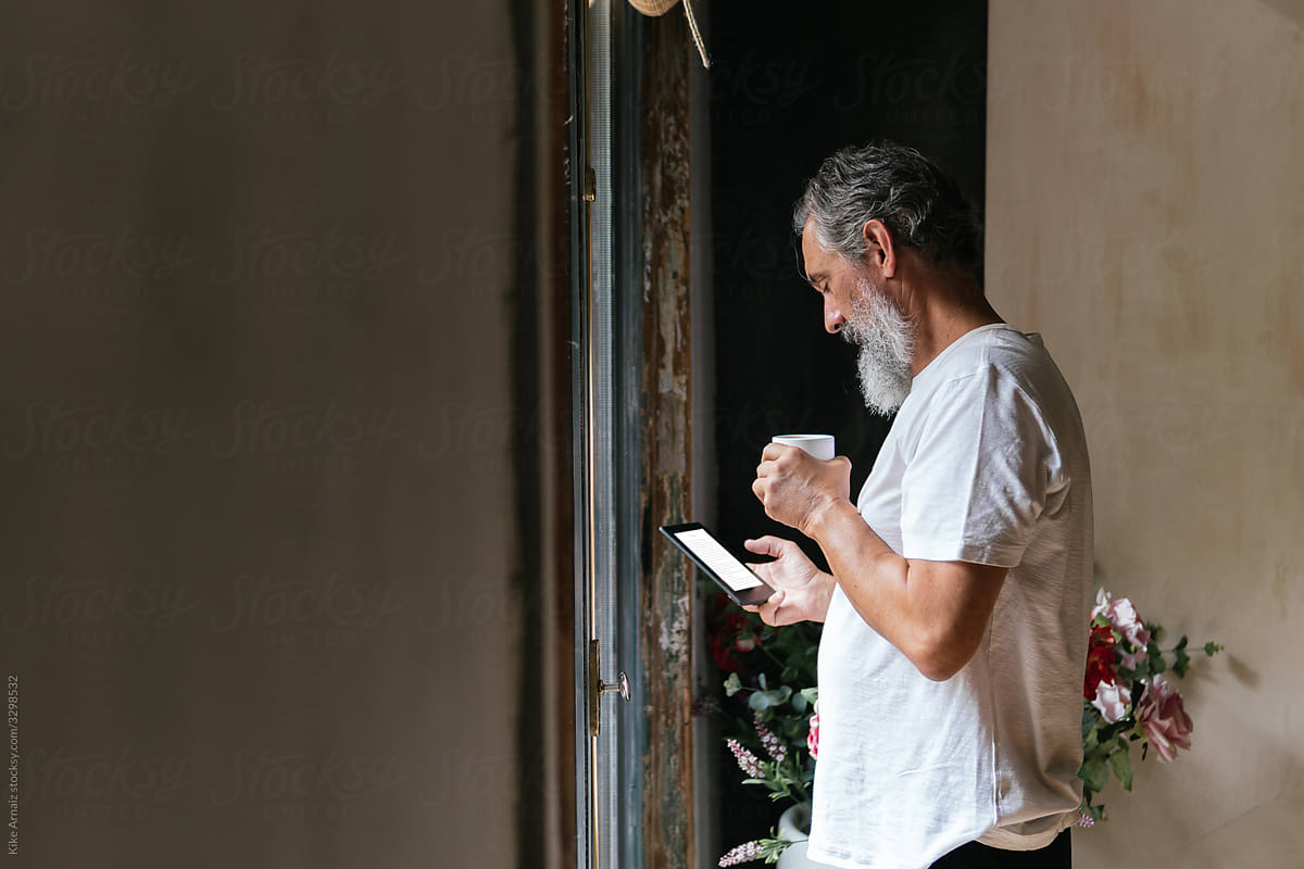 Senior man using e-book