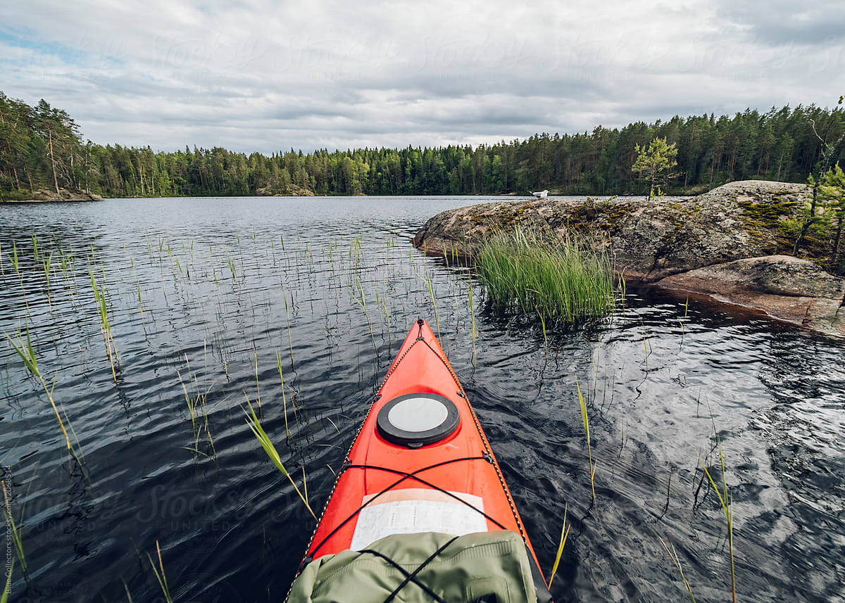 Kayaking on a calm lake of Finland