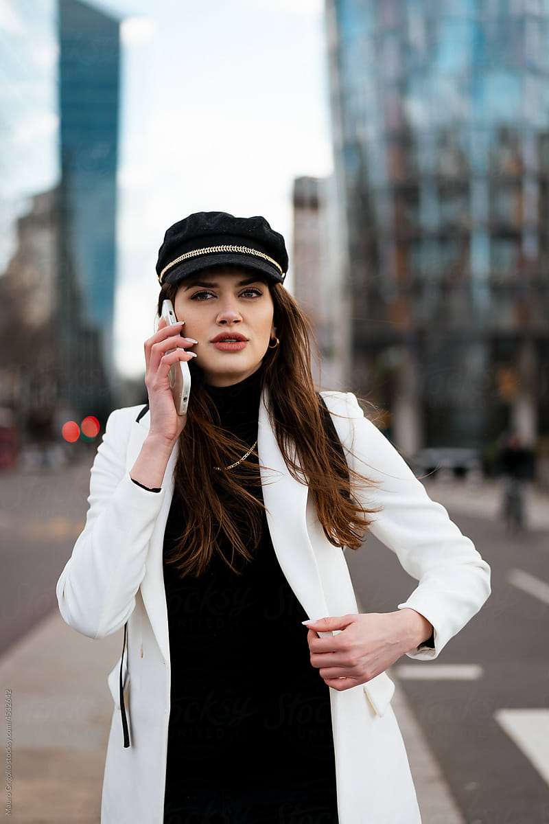 A pretty Businesswoman making a call in the city