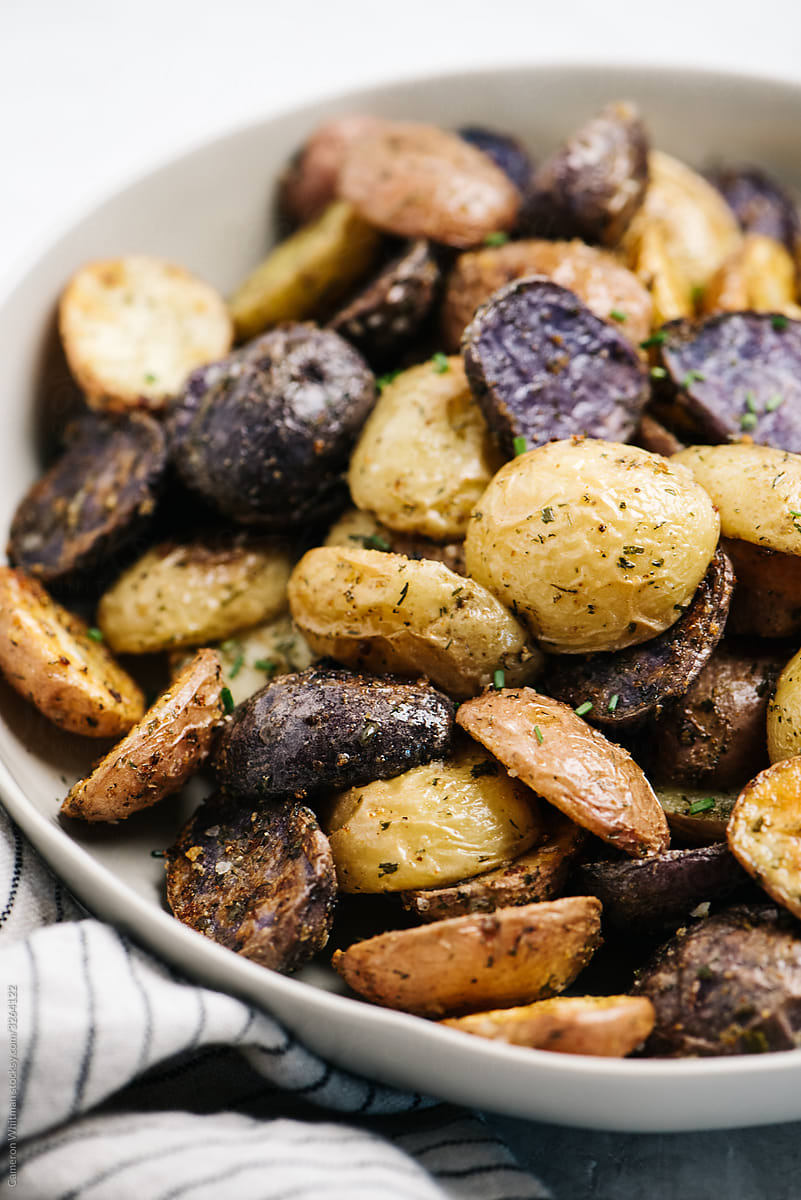 Roasted and seasoned halves of fingerling potatoes